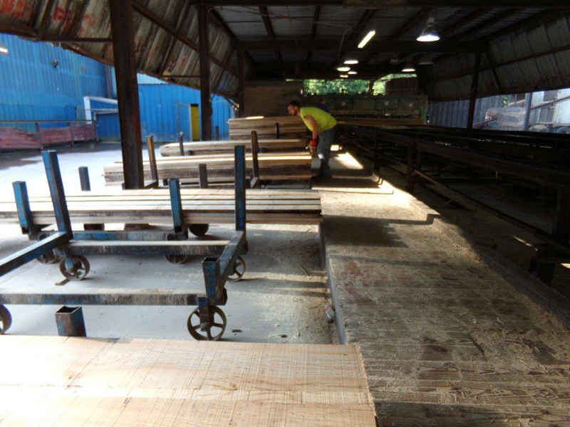 Worker sorting lumber